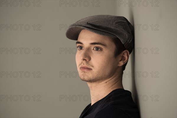 Young man wearing a peaked cap