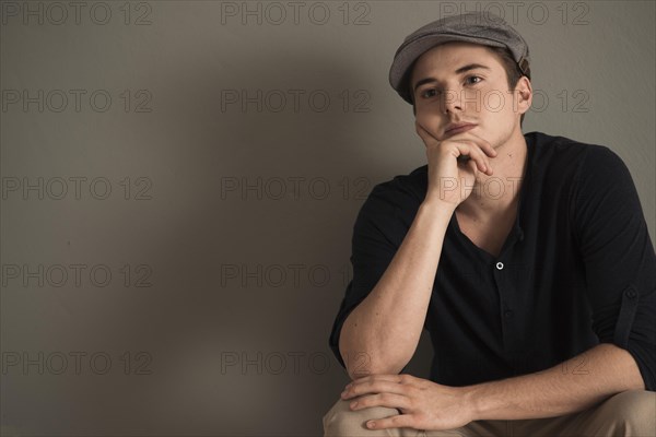 Young man wearing a peaked cap