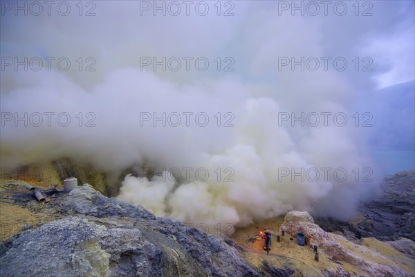 Sulfur miners mining sulfur at Ijen Volcano