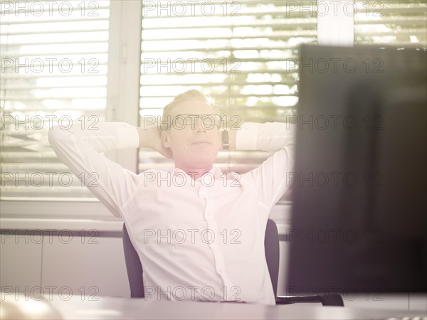 Man sitting in front of his computer in an office