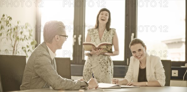 Smiling colleagues in a conference room