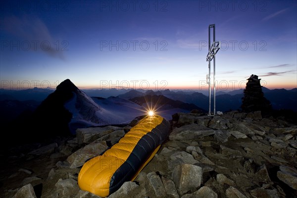 Mountain climber sleeping on the summit of Wilder Pfaff Mountain