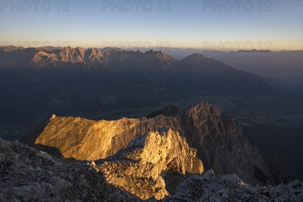 First sun rays on the peak of Serles Mountain