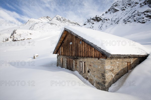 Snowcovered mountain hut