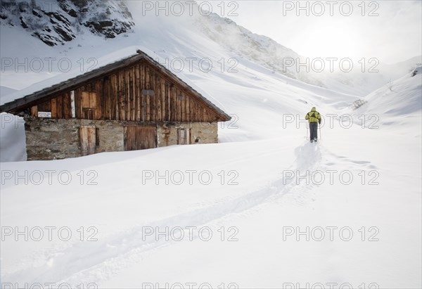 Ski walker at a mountain hut