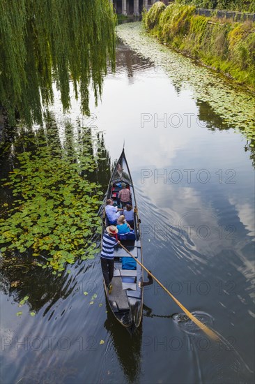 Gondolier in a gondola on the Karl-Heine Canal