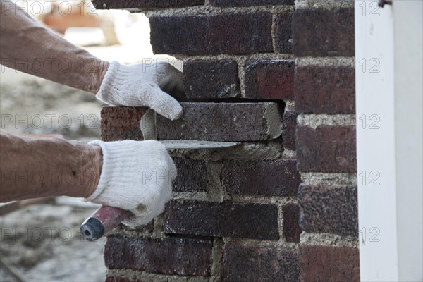 Worker renovating the historic Miller High School