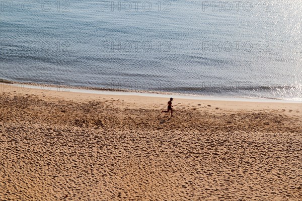 Jogger at the beach