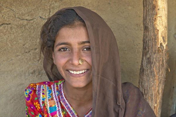 Young Indian woman with a headscarf and nose jewellery