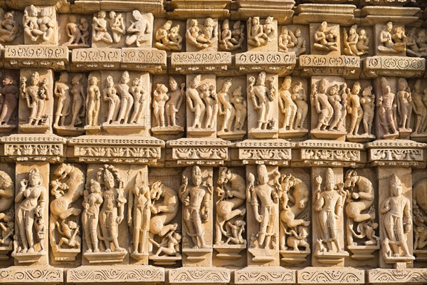 Relief sculptures of gods and men on the facade of the Parshvanath Temple