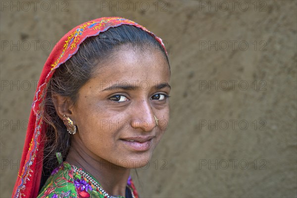 Girl with a headscarf and jewellery