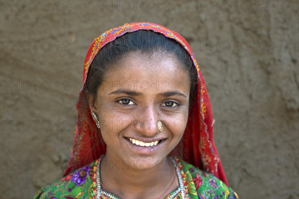 Girl with a headscarf and jewellery