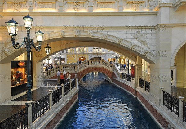 Tourists in a replica of Venetian streets under an artificial sky