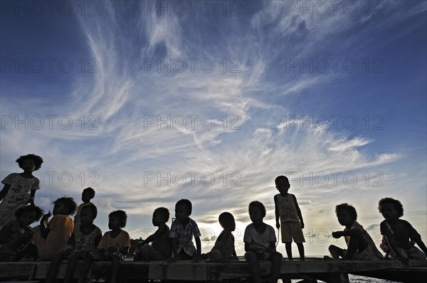 Children on a jetty