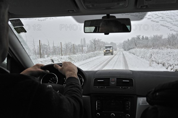 View through the windscreen during snowfall