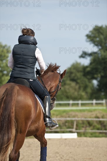 Woman riding a horse