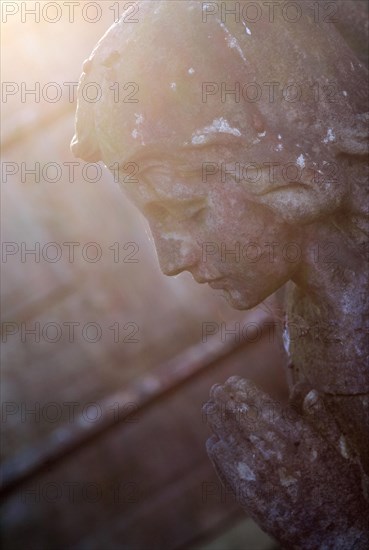 Praying stone angel