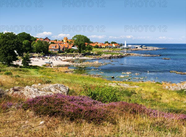 View of Allinge with bathing area and smokehouse on the rocky coast of the Baltic Sea