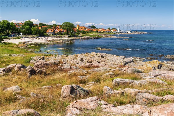 View of Allinge with bathing area and smokehouse on the rocky coast of the Baltic Sea