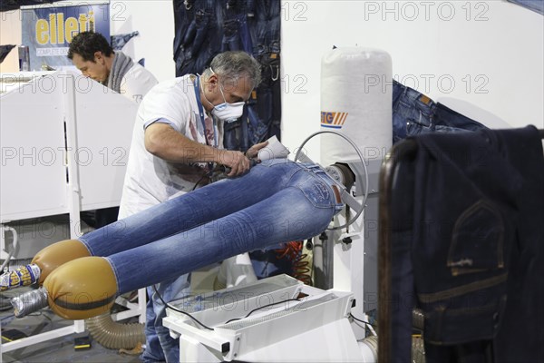 Jean production at the stand of "Pepe Jeans"