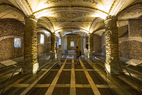 Stacked bones and skulls in the ossuary