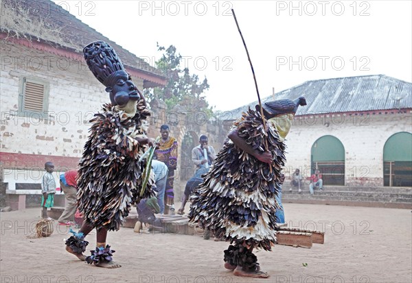 Traditional mask dance with a xylophone and flutes at the Palace of Bafut