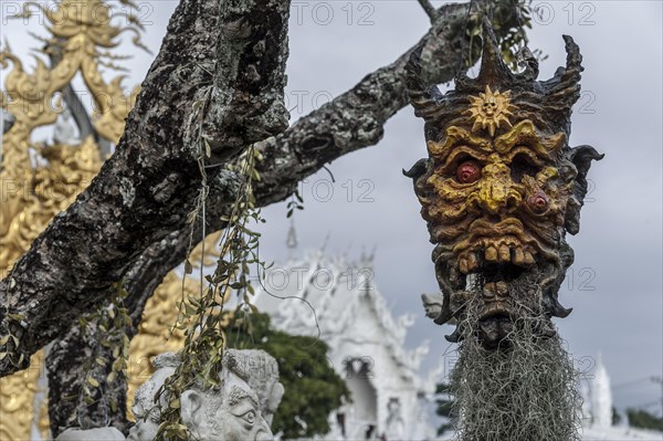 A mask hanging on a tree