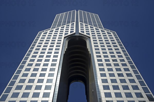 Dubai Dusit Thani Hotel on Sheikh Zayed Road against a blue sky