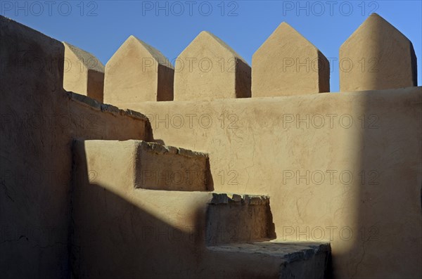 The wall and stairs inside Rustaq Fort