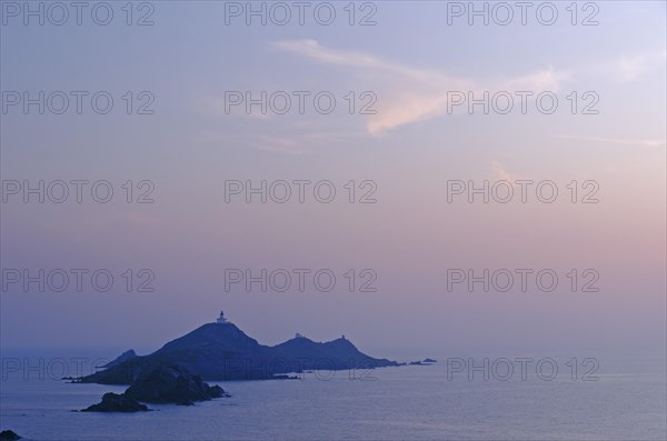 Les Iles Sanguinaires in the mediterranean sea at the blue hour after sunset seen from Tour de la Parata. Les Iles Sanguinaires are in the department Corse-du-Sud