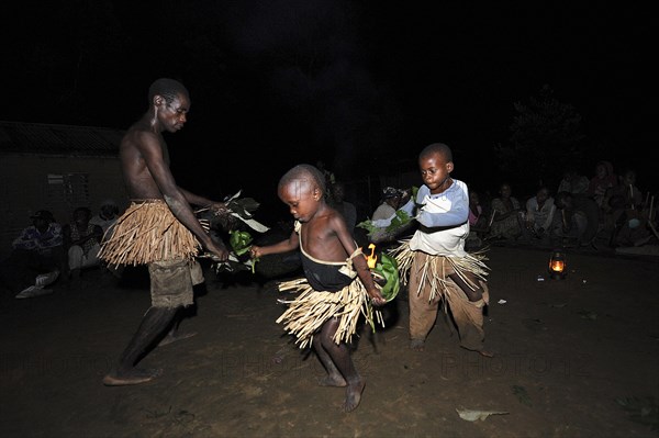 Pygmies of the Bakola people celebrating with song and dance