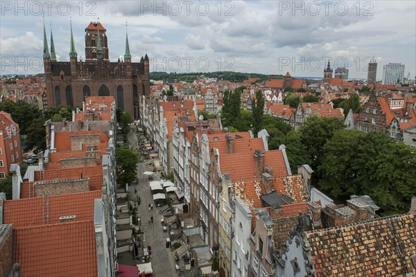 Overview of Mariacka Street or Ulica Mariacka with the historic patrician houses and St. Mary's Church