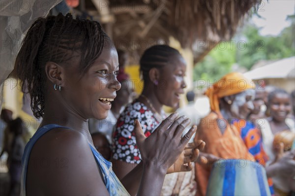 Villagers celebrating a festival with traditional dance and music