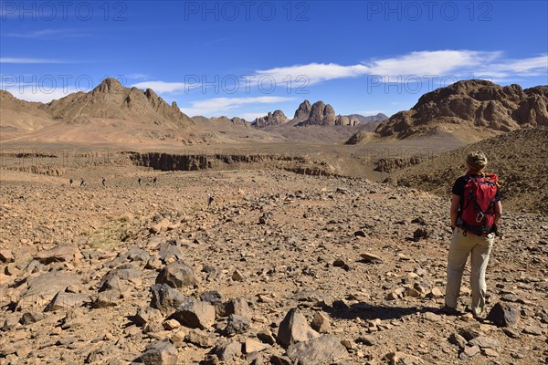 Female hiker standing in the volcanic landscape at Atakor