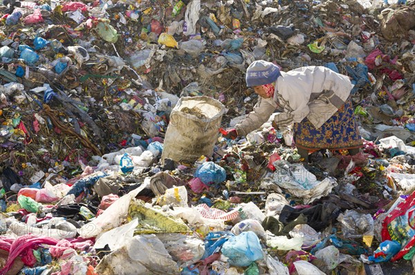 Woman sorting out garbage at Aletar garbage dump