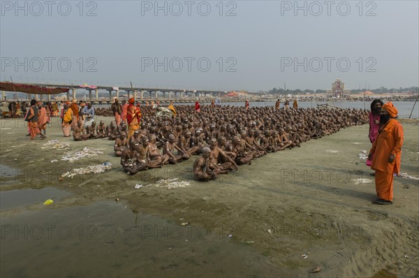 Sitting in silence as part of the initiation of new sadhus at the Sangam