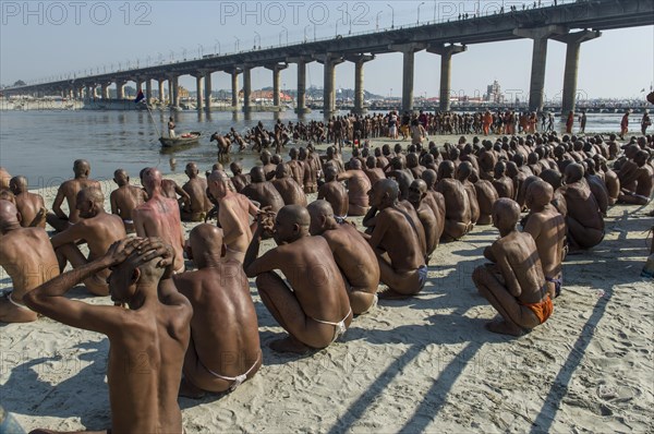 Sitting in silence at the river Ganges as part of the initiation of new sadhus