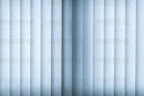 Blue blinds made of fabric with backlighting