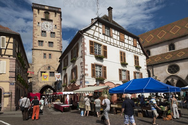 Place de Hotel de Ville with a market and the city tower