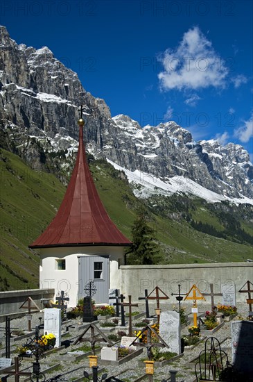 Mountain cemetery at the St. Erhard chapel at the foot of the Glarus Alps