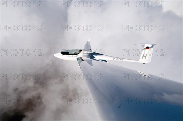 Glider type ASH 26 E above the clouds