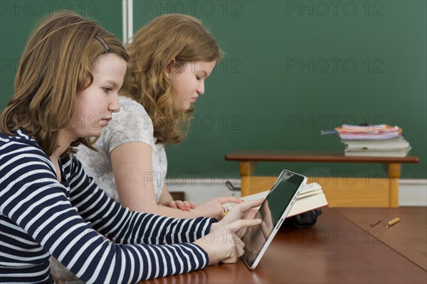 Two schoolgirls in the classroom