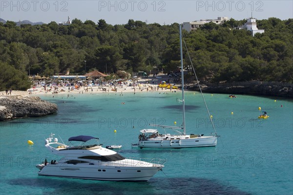 Yacht in front of the Caló d'en Garrot beach