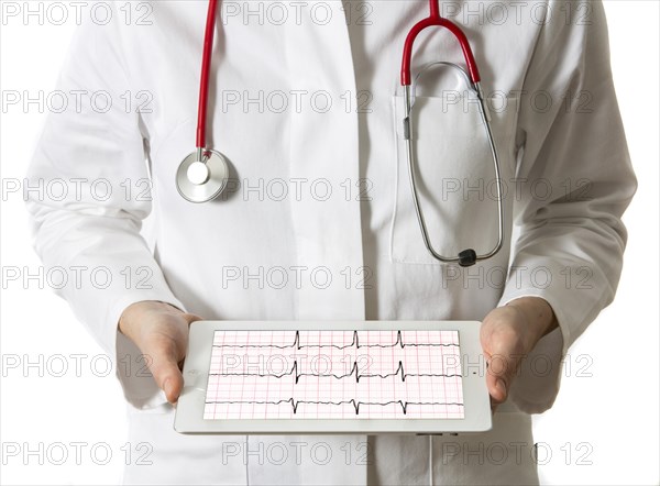 Female doctor holding a tablet computer