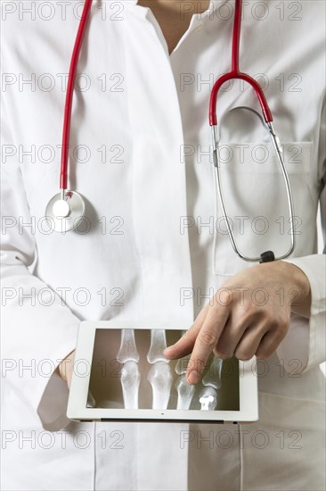Female doctor holding a tablet computer