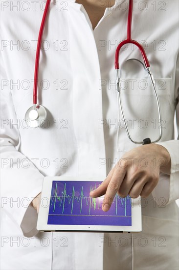 Female doctor holding a tablet computer