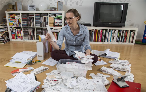 Woman sorting documents