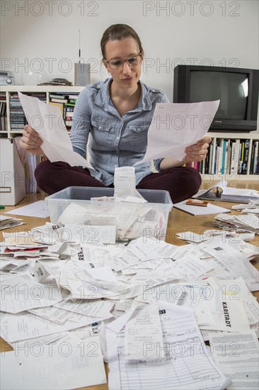 Woman sorting documents