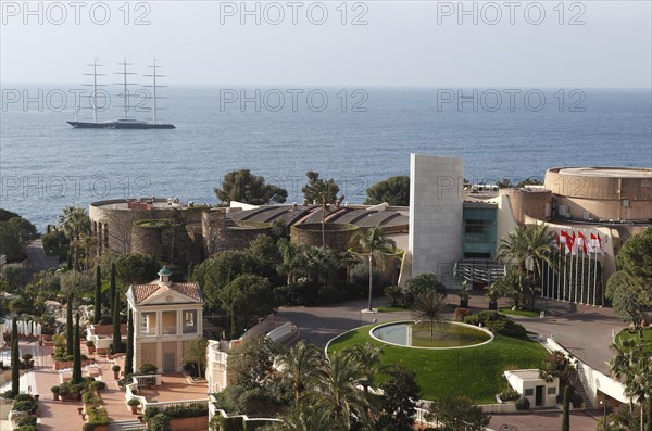 View from the balcony of the Monte Carlo Bay Hotel & Resort over the garden and  Jimmy'z Night Club towards the sea with the large yacht Maltese Falcon