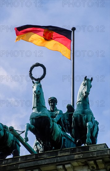 The flag of the GDR flying above the Quadriga on Brandenburg Gate